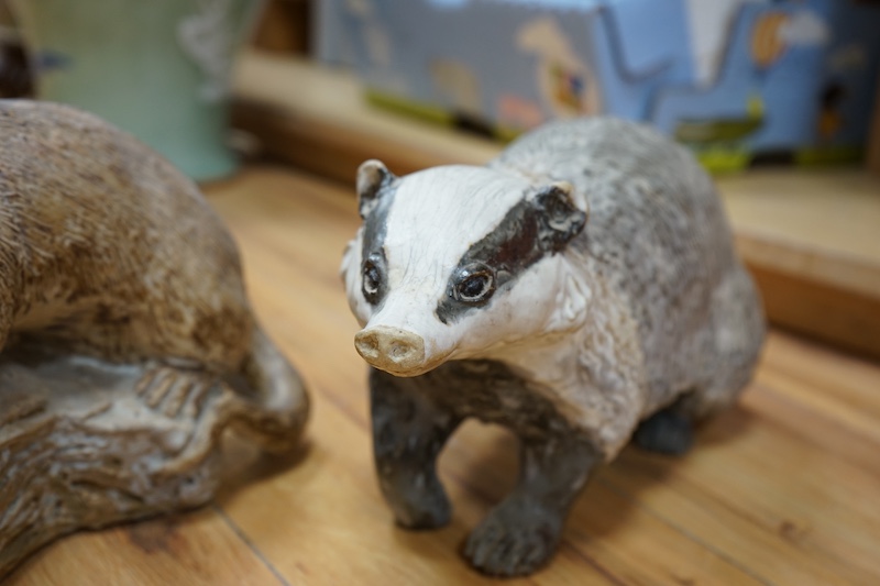 Audrey Carter, three studio pottery animal models, an owl, otter and badger, 37cm. Condition - good